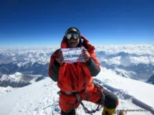 Alan with sponsor flag on K2 summit