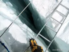 Crossing a ladder in Khumbu Icefall